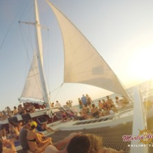 Tourists sunbathing on catamaran
